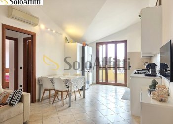 Soggiorno con cucina a vista - Trilocale Via Eugenio Montale 12, Limbiate - foto 2