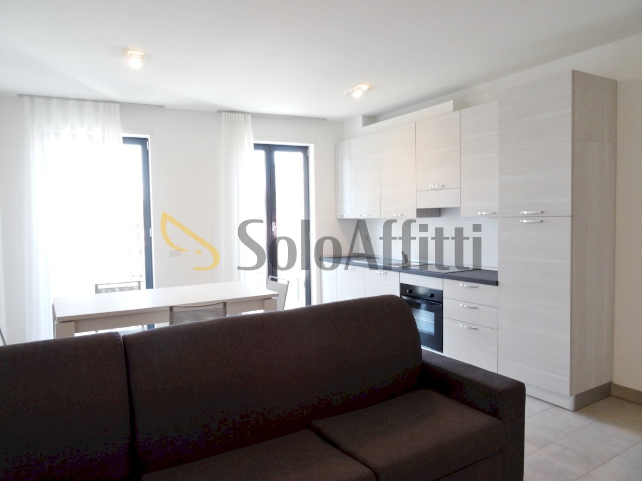 soggiorno con angolo cottura - Appartamento Gallarate - foto 2